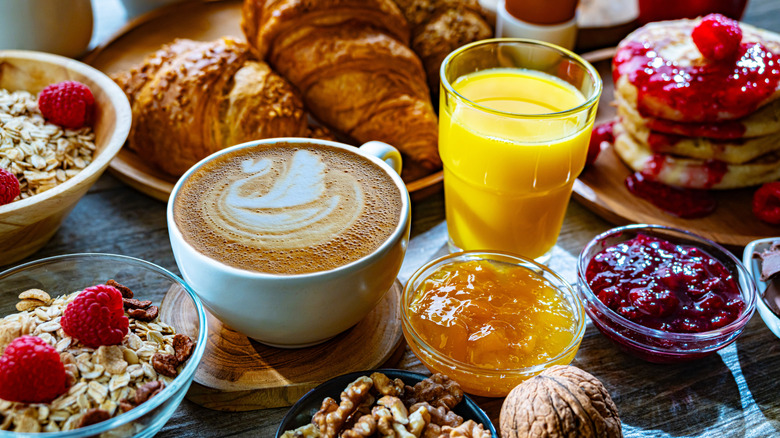 coffee surrounded with breakfast foods