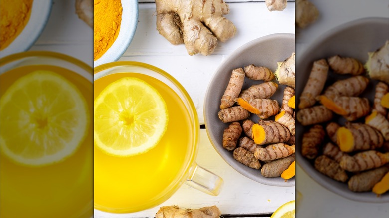 Overhead view of turmeric tea in a mug with lemon and ginger