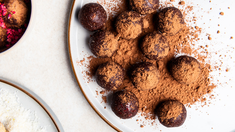 Chocolate-covered pie bites with cocoa powder
