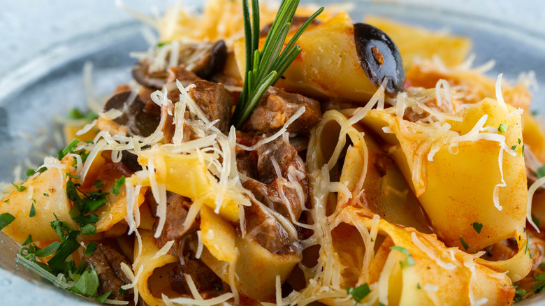 Pappardelle noodles with beef chunks and rosemary