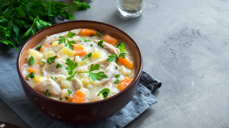 chicken and wild rice soup with green parsley leaves