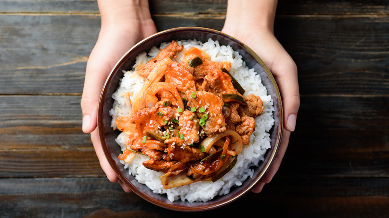 stir fried kimchi pork over white rice