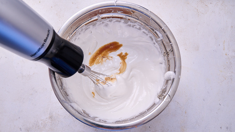 whisking vanilla into egg whites