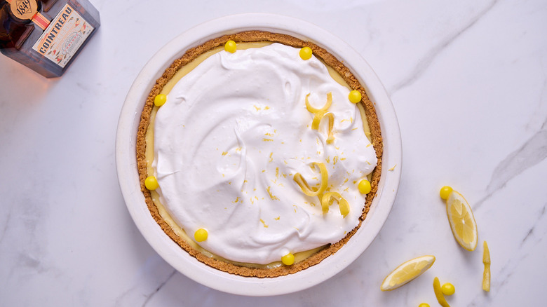 garnishing lemon pie with candy