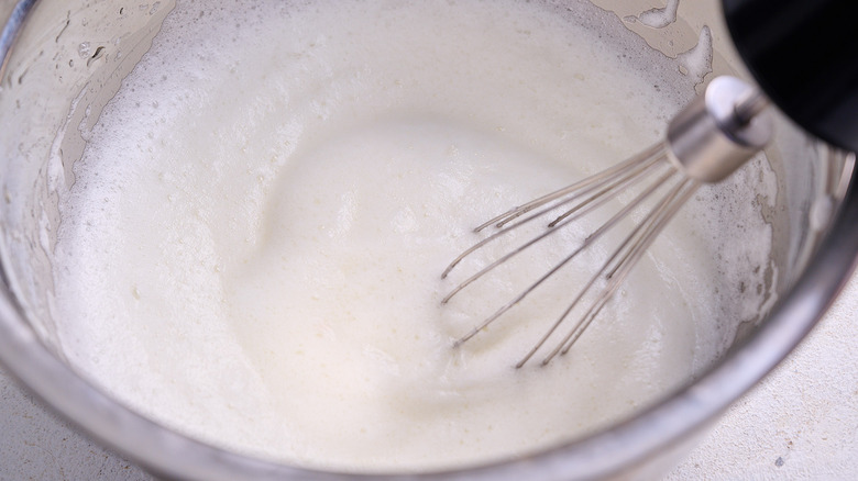 whipping egg whites until frothy