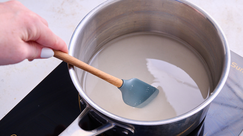 stirring syrup in pot