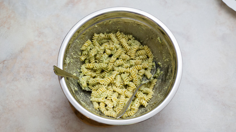 pesto pasta in metal bowl