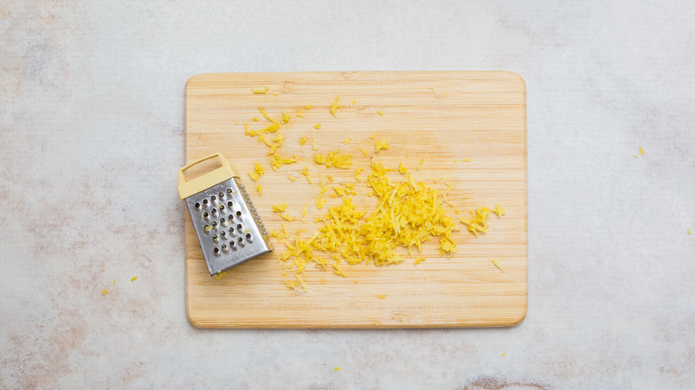 lemon zest on wooden board