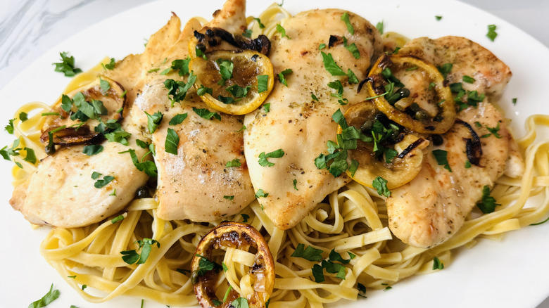 Lemony chicken piccata on serving platter