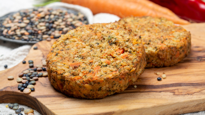 Closeup of lentil veggie burgers on a cutting board