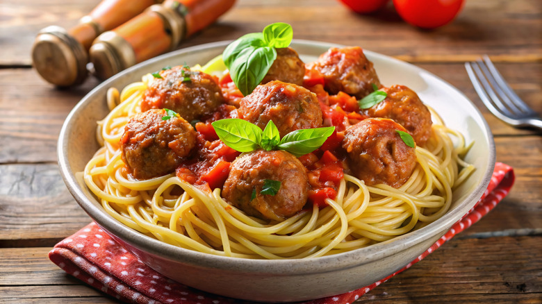 Spaghetti and meatballs with basil