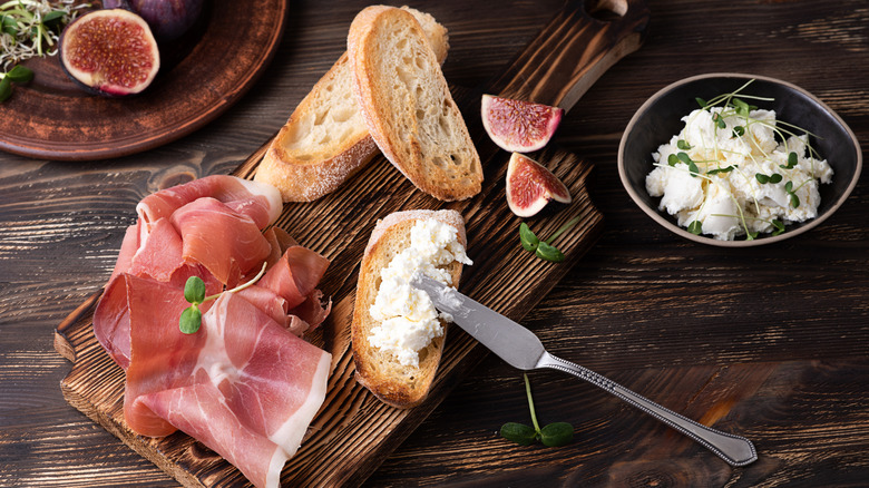 Italian meal of cheese, figs, and prosciutto