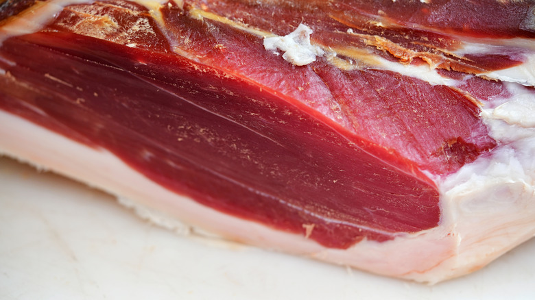 Close up of a thick portion of prosciutto crudo