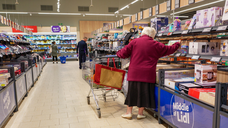 shopper buying in Lidl's middle aisle
