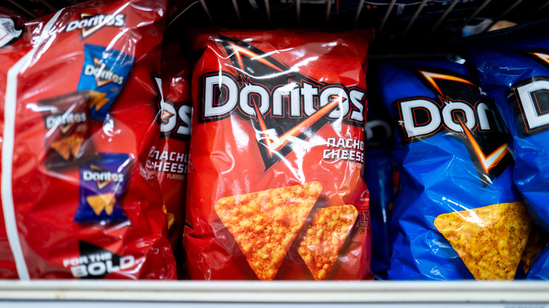 Bags of Nacho Cheese and Cool Ranch Doritos on a store shelf