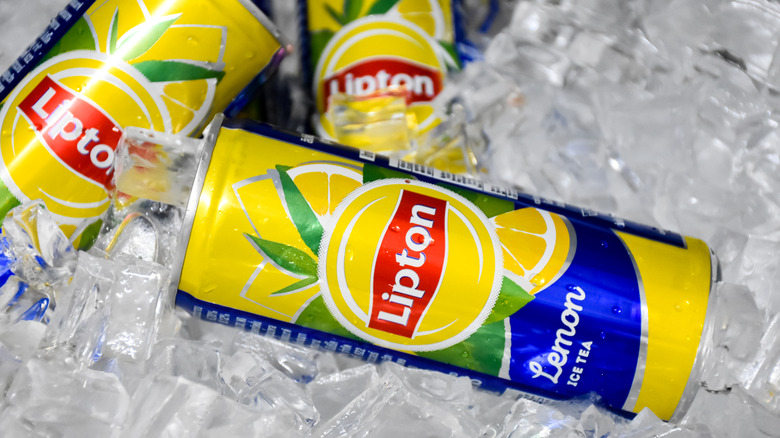 cans of Lipton lemon iced tea on ice