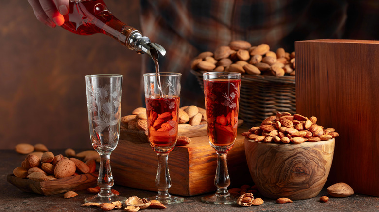 almond liqueur being poured into small glasses