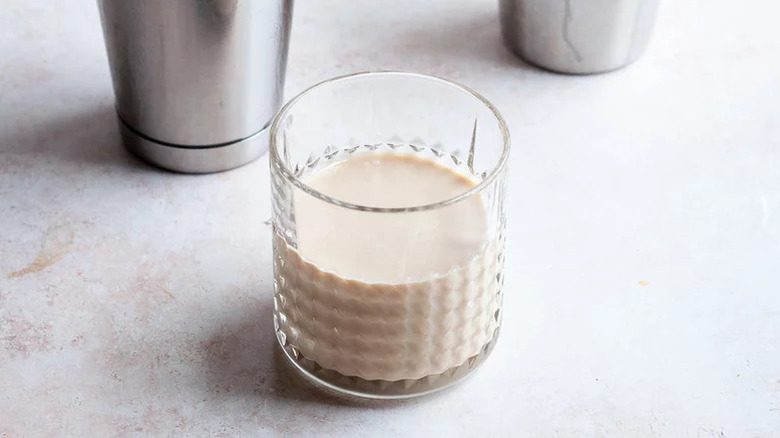White Russian Cocktail in a glass on a marbled counter