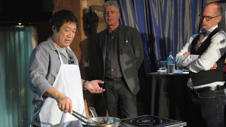 Anthony Bourdain watching KF Seetoh cook curing a demonstration