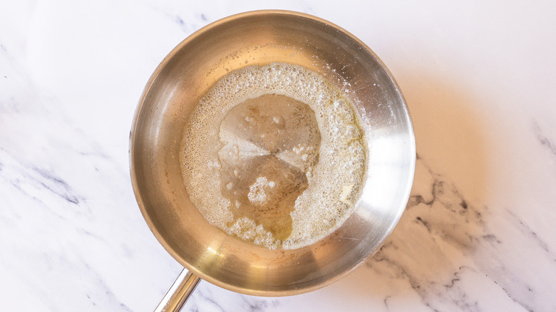 Pan with melted butter.