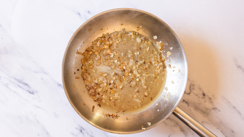 Pan with garlic, shallots, and wine.