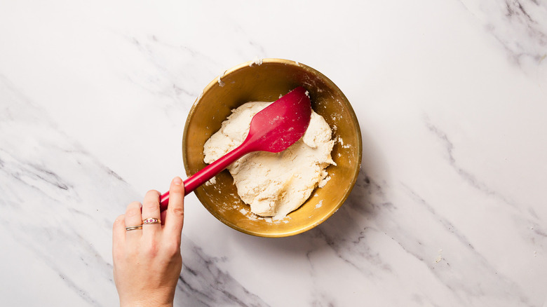 Mixing dough with spatula