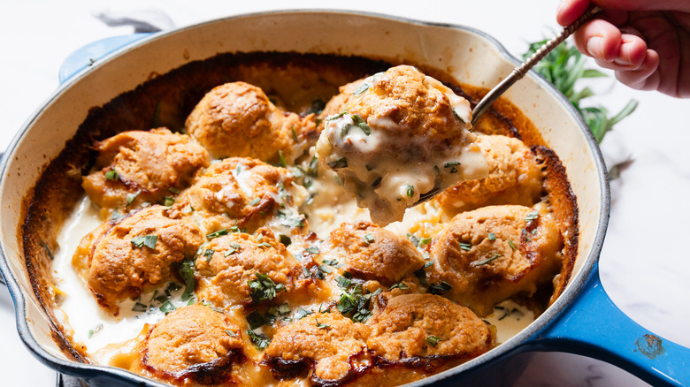 Serving a spoonful of tarragon lobster pot pie