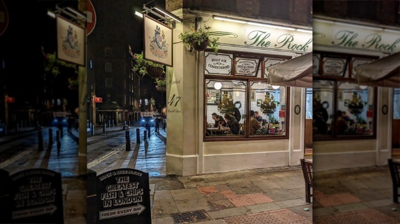 Diners eating inside fish and chip shop