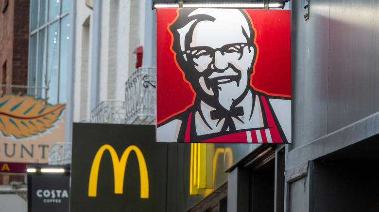 KFC and McDonald's signs beside one another