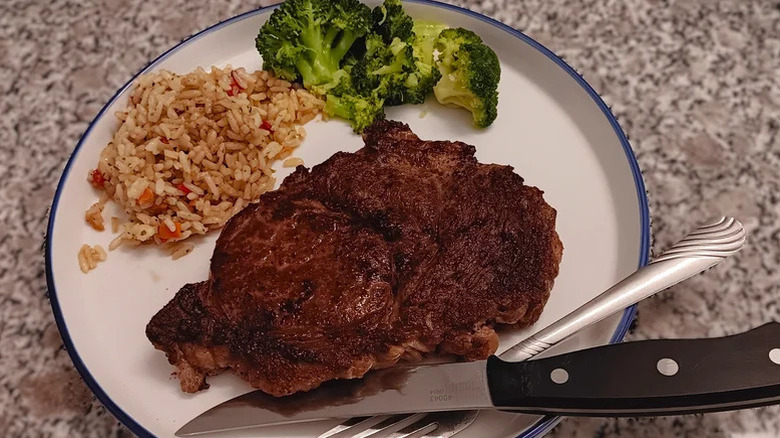 LongHorn Steakhouse ribeye with broccoli and rice