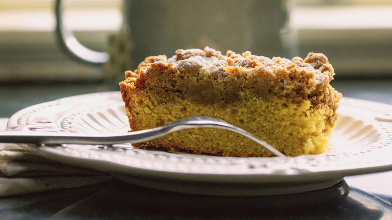 Piece of coffee cake on plate with fork