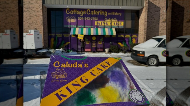 Box of Caluda's King Cake for Halloween with orange icing