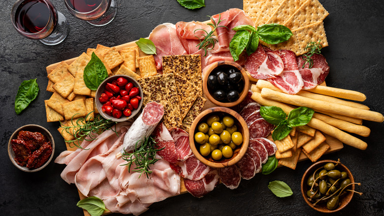 charcuterie board on a black background