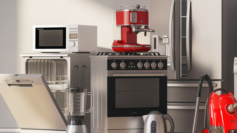 Various kitchen appliances in an otherwise empty room