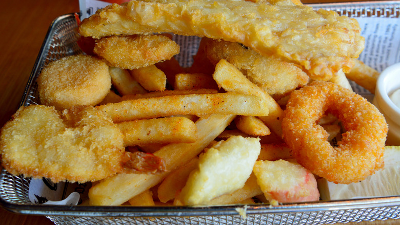 Seafood basket with various fired battered fish fillets
