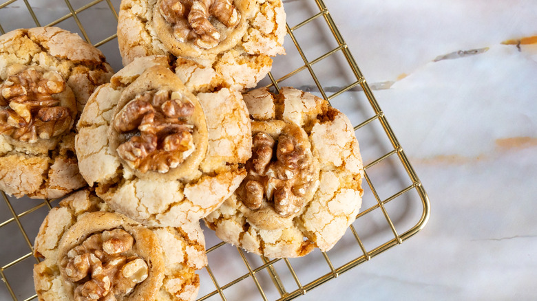 homemade walnut cookies on a cooling rack