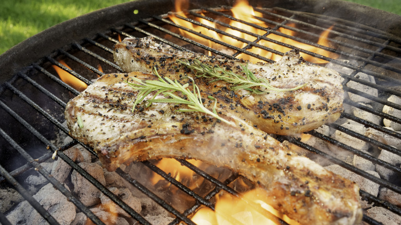 Meat cooking on charcoal grill