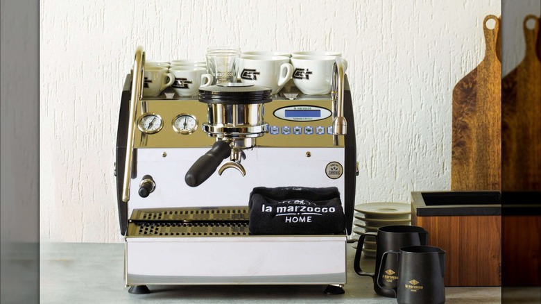 La Marzocco GS3 with several mugs on a kitchen counter
