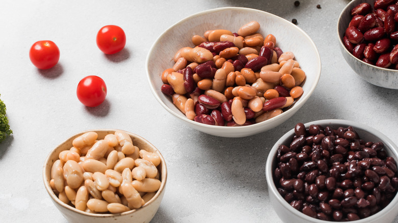 Different types of canned beans in bowls