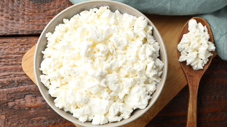 A bowl and spoon of cottage cheese