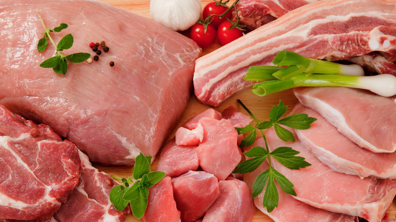 Raw pork cuts and vegetables
