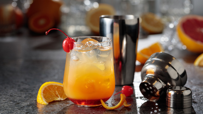 An iced glass of tequila sunrise cocktail