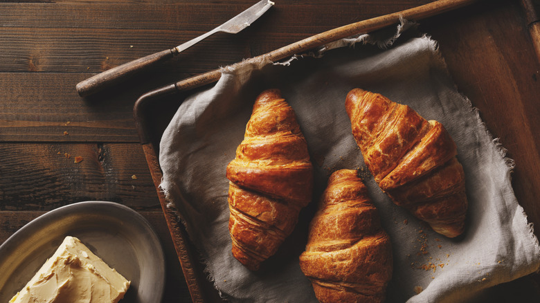 Three croissants on a cloth