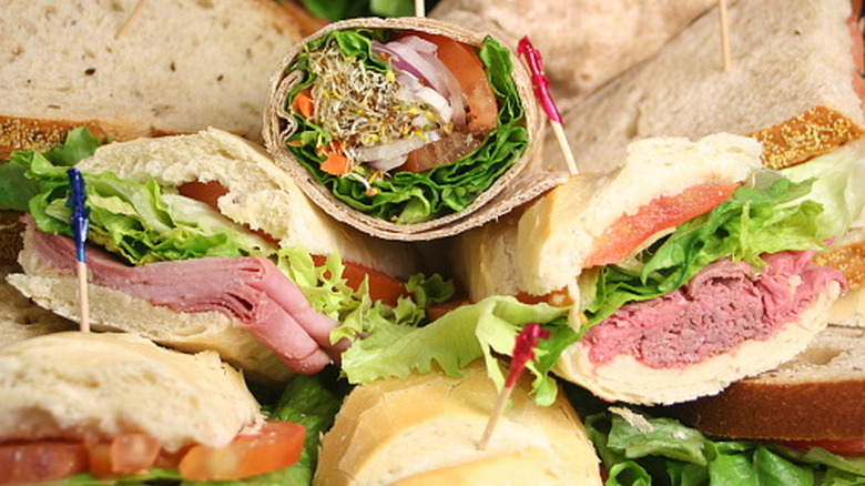 Catering tray full of assorted sandwiches like wraps