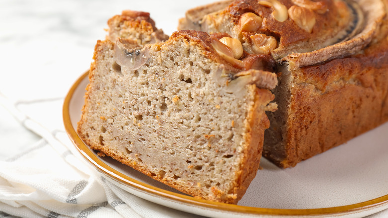 Close-up of a sliced loaf of homemade banana bread on a plate