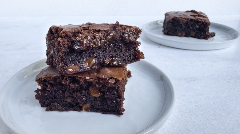 boxed brownies with caramel chips mixed in, sitting on a white plate