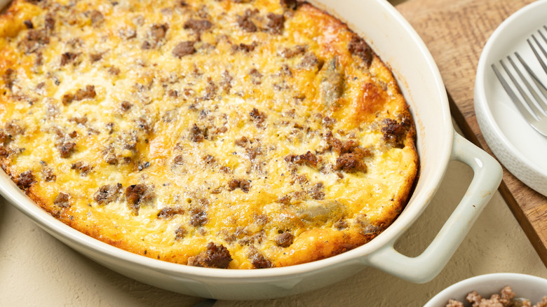 a white baking dish filled with breakfast casserole