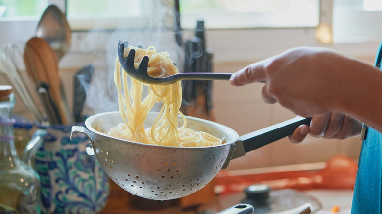 Colander on top of glass bowl