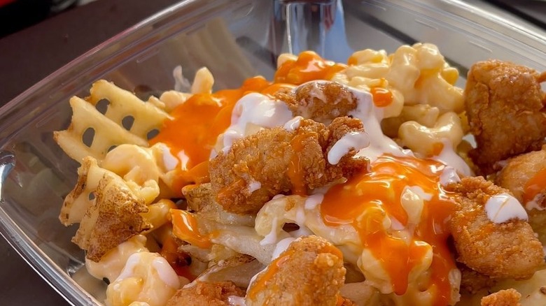 close up of chick-fil-a nuggets and fries with buffalo and ranch sauce