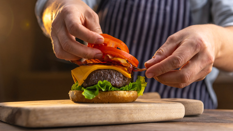 person making a burger